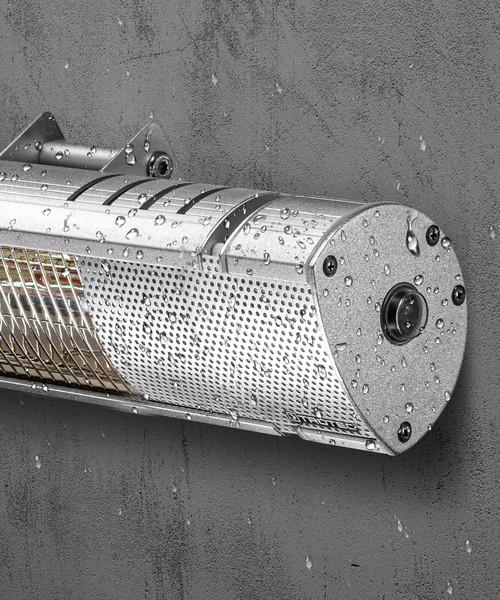Image of the silver KMH-30R 3KW Infrared Wall Mounted Outdoor Garden Heater covered in rain droplets against a dark grey background