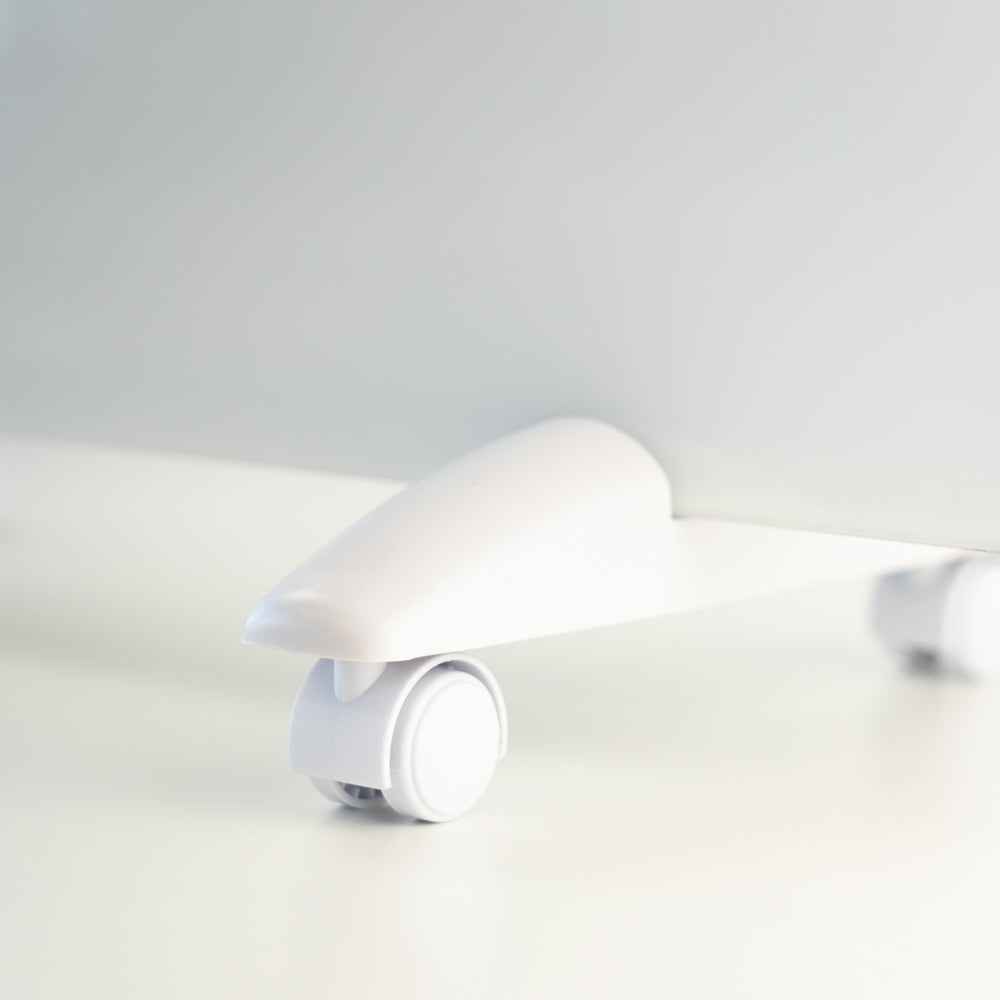 Close up of the portable wheels on the white designer electric glass panel heater