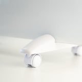 Load image into Gallery viewer, Close up of the portable wheels on the white designer electric glass panel heater
