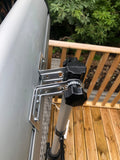 Load image into Gallery viewer, Close up of the KMH-3000R 3KW Free Standing Infrared Heater&#39;s angle adjuster on a wooden patio deck with greenery in the background
