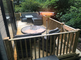 Load image into Gallery viewer, KMH-3000R 3KW Free Standing Infrared Heater on a wooden patio next to a grey outdoor corner sofa and wicker grey table