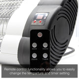 Load image into Gallery viewer, Close up of the KMH-2500R 2.5KW Free Standing Infrared Heater remote with the infrared heater in the background and the caption &quot;remote control functionality allows you to easily change the temperature and timer setting&quot;